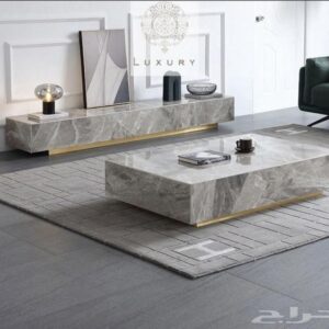 table basse effet massif pietra grigia et bande en laiton